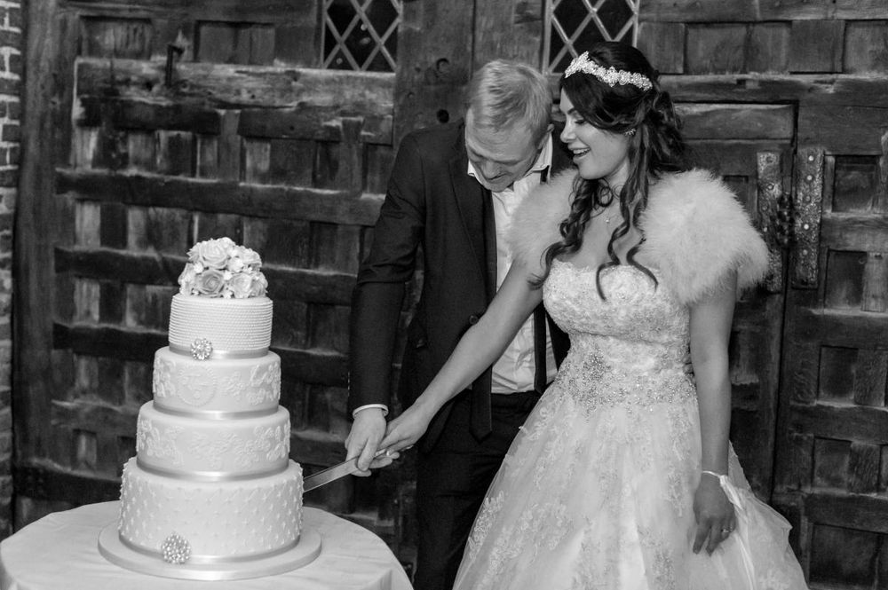 tryfonas wed couple cuts cake black 18