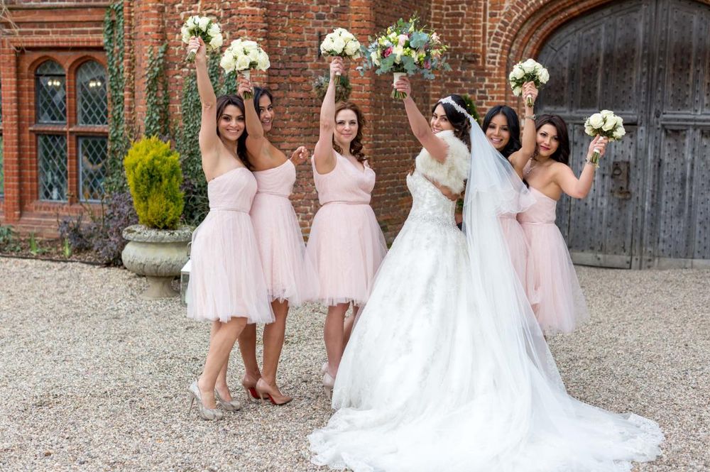 tryfonas wed bride with friends holding up bouquets 22