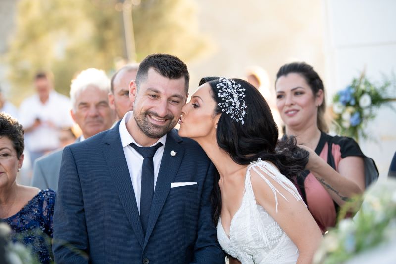 vog bride kisses groom at church